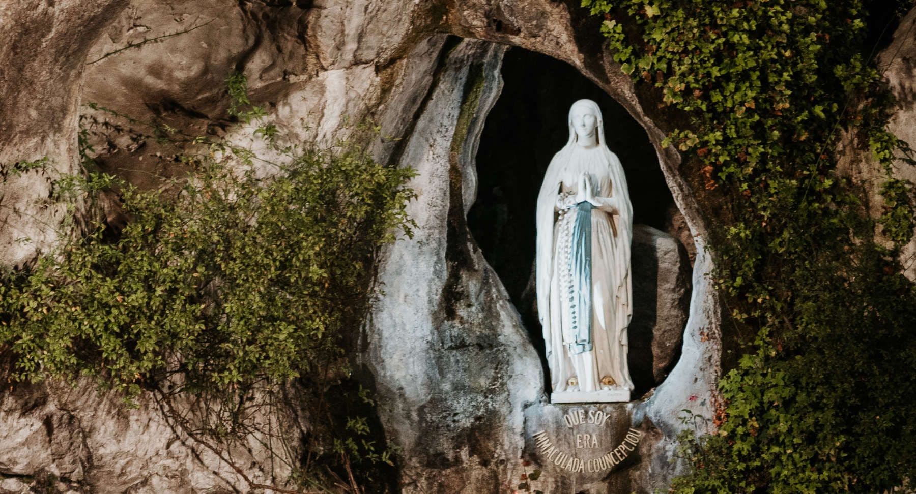 The place where Mary stood at Massabielle Grotto with the inscription of her message I am the Immaculate Conception Lourdes France