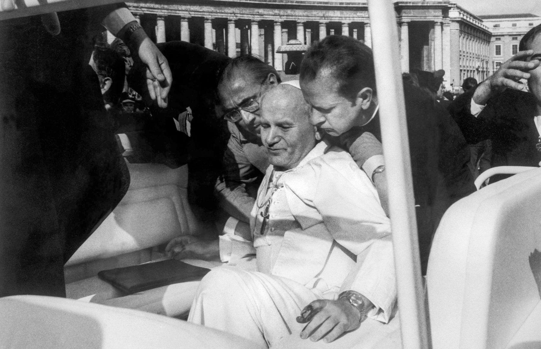 Blood on his hands John Paul II assisted by aides moments after he was shot in Saint Peter