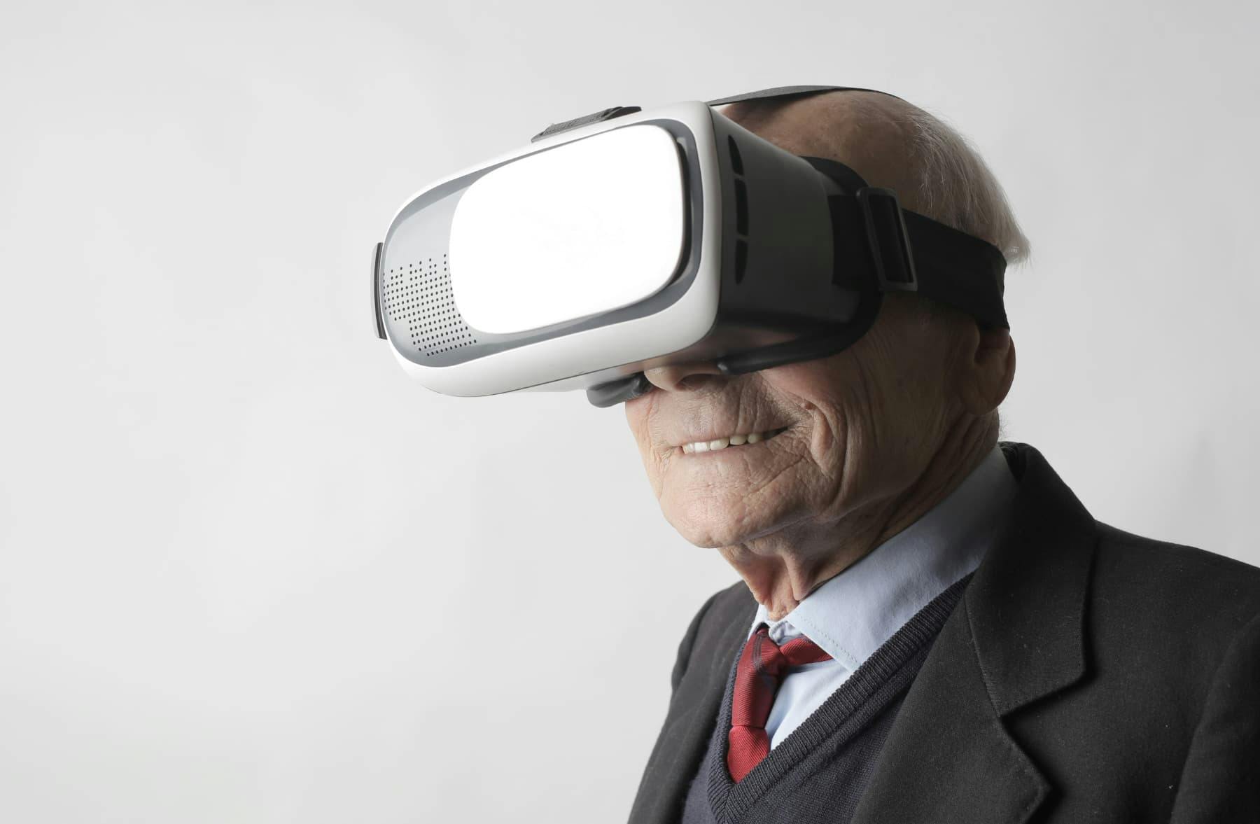 old man VR headset metaverse suit smiling